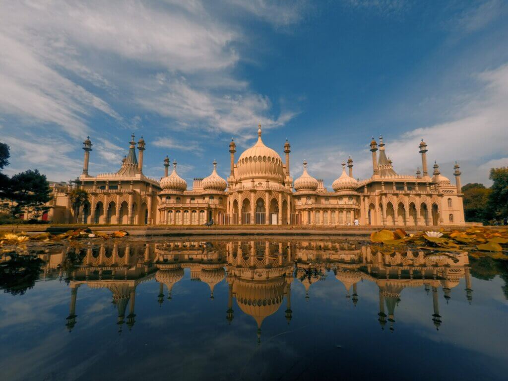 The facade of the Royal Pavilion in Brighton reflecting on the water