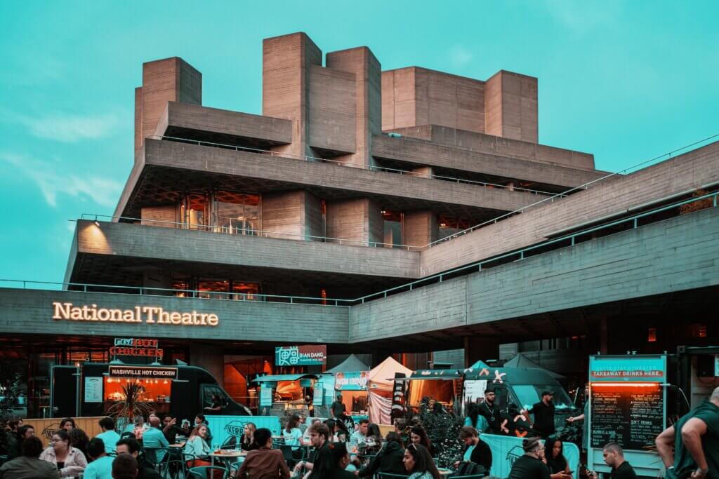 National Theatre in London with cafes, street food stalls and a lot of people