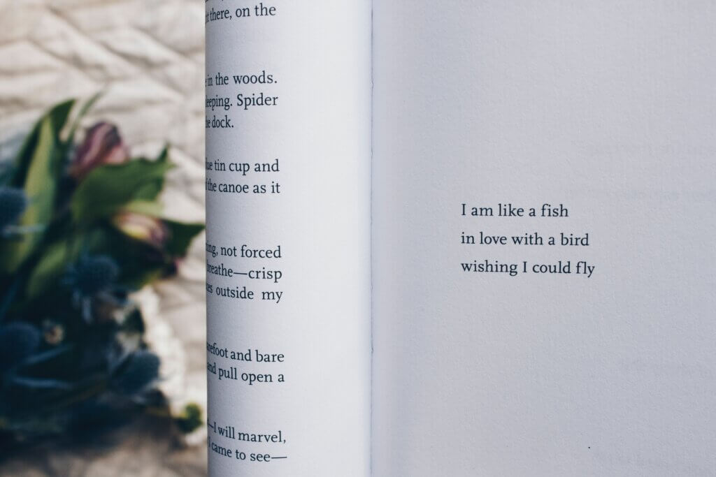 An open book with a short poem on the page