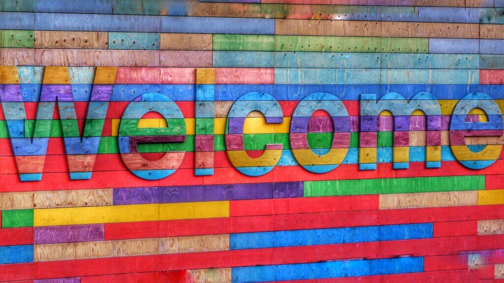 A colourful welcome sign as street art