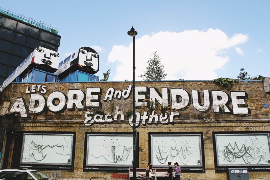 "Let's adore and endure each other" street art