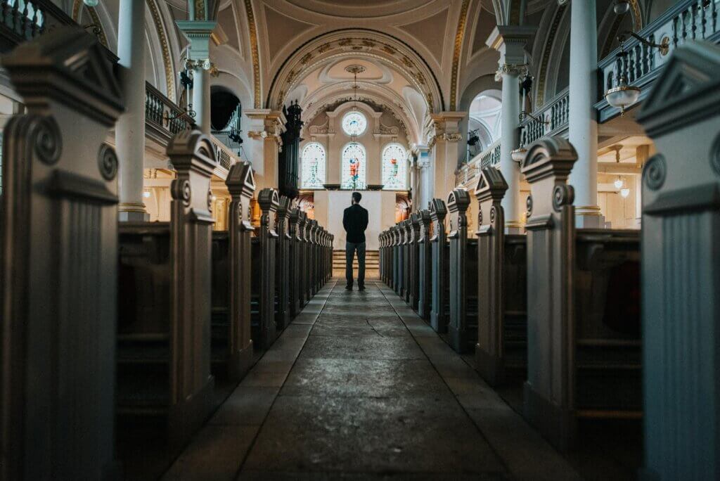 Person standing in a church