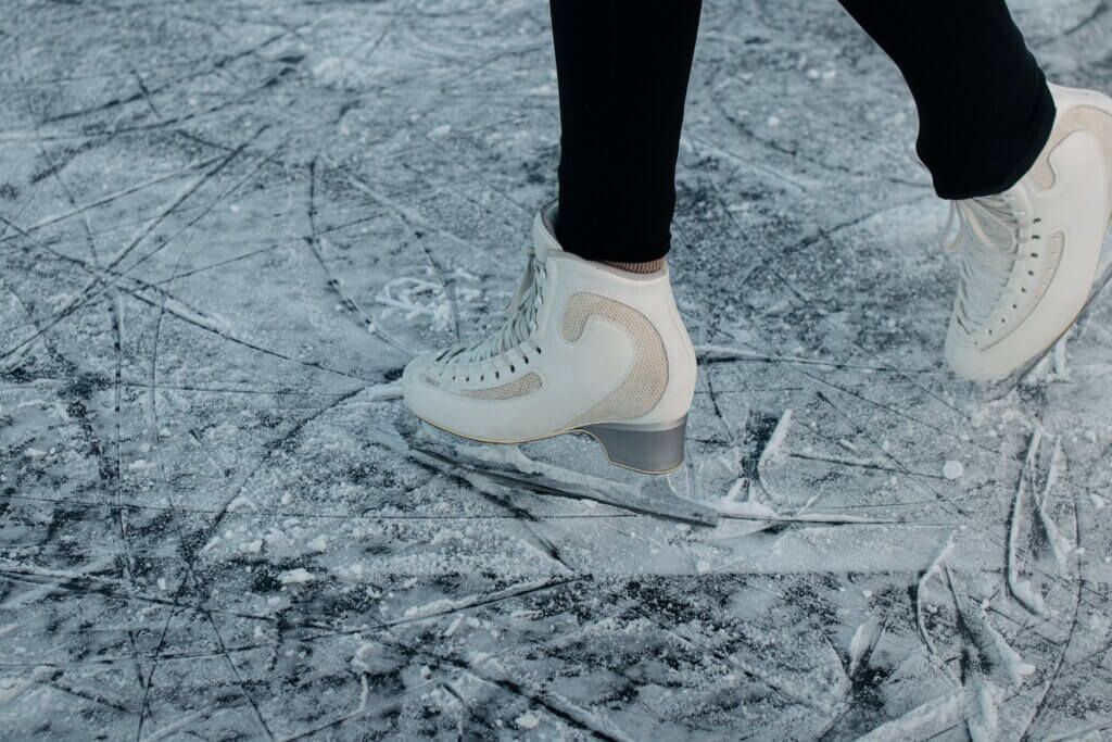 Someone in ice skates on top of the ice