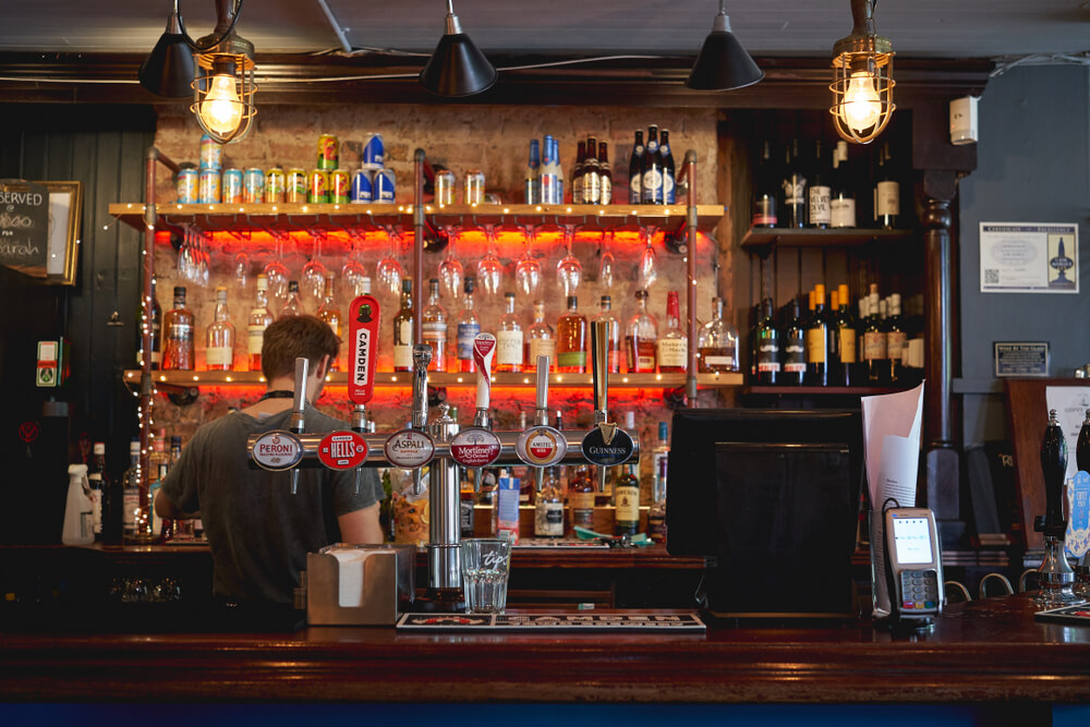 People working behind the bar at one of the best East London Bars